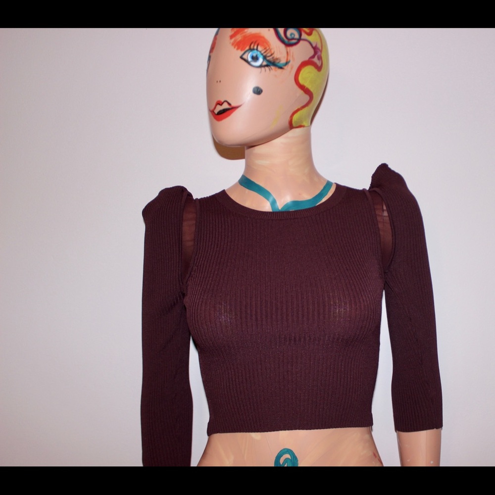 A maroon crop top with shoulder detail.